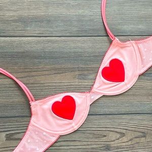 Out From Under pink bra with red heart patches in size S